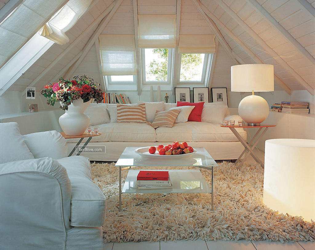 Neutral Room with Coral Accents and Vaulted Ceilings