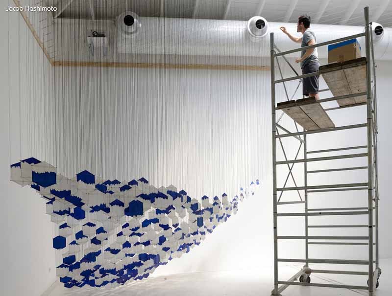 Jacob Hashimoto working on one of his 3D Kite Installations