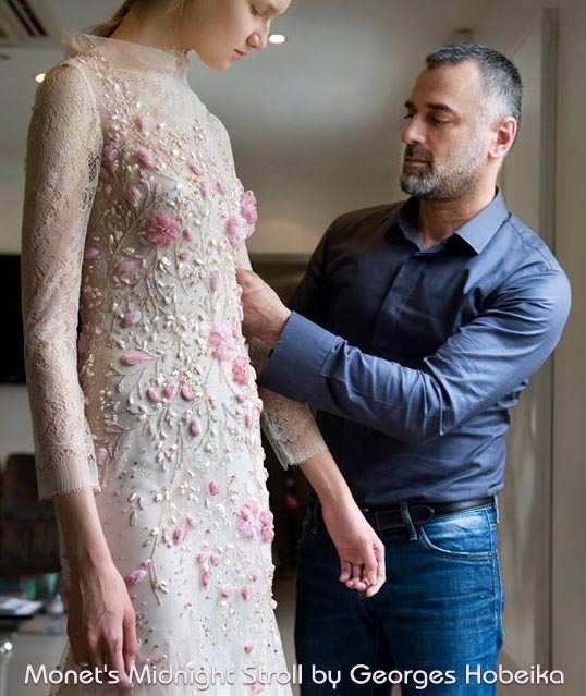 Georges Hobeika works on a couture gown from his Monet's Midnight Stroll Couture Collection
