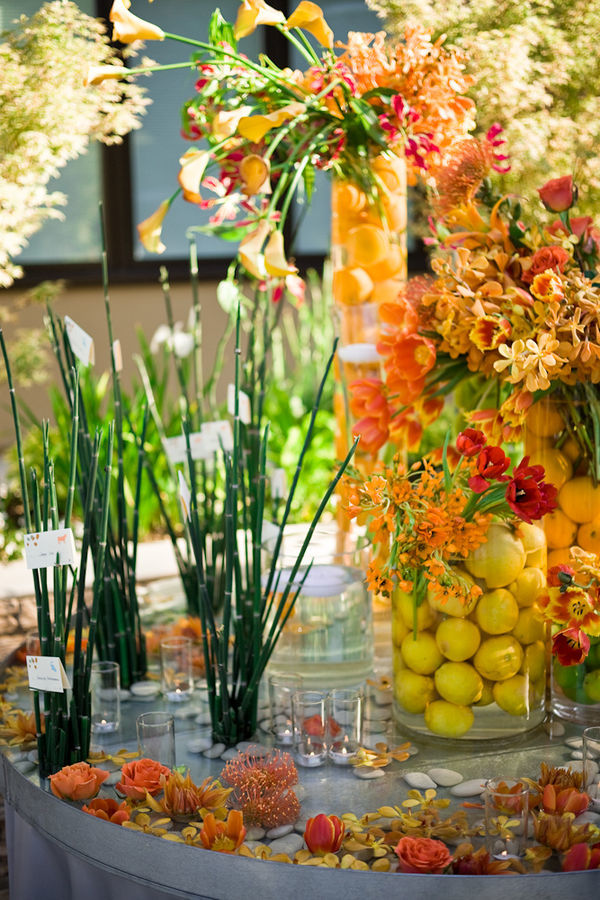 Fruit filled floral vases by Event Planner Waterlily Pond - Photo by Cliff Brunk