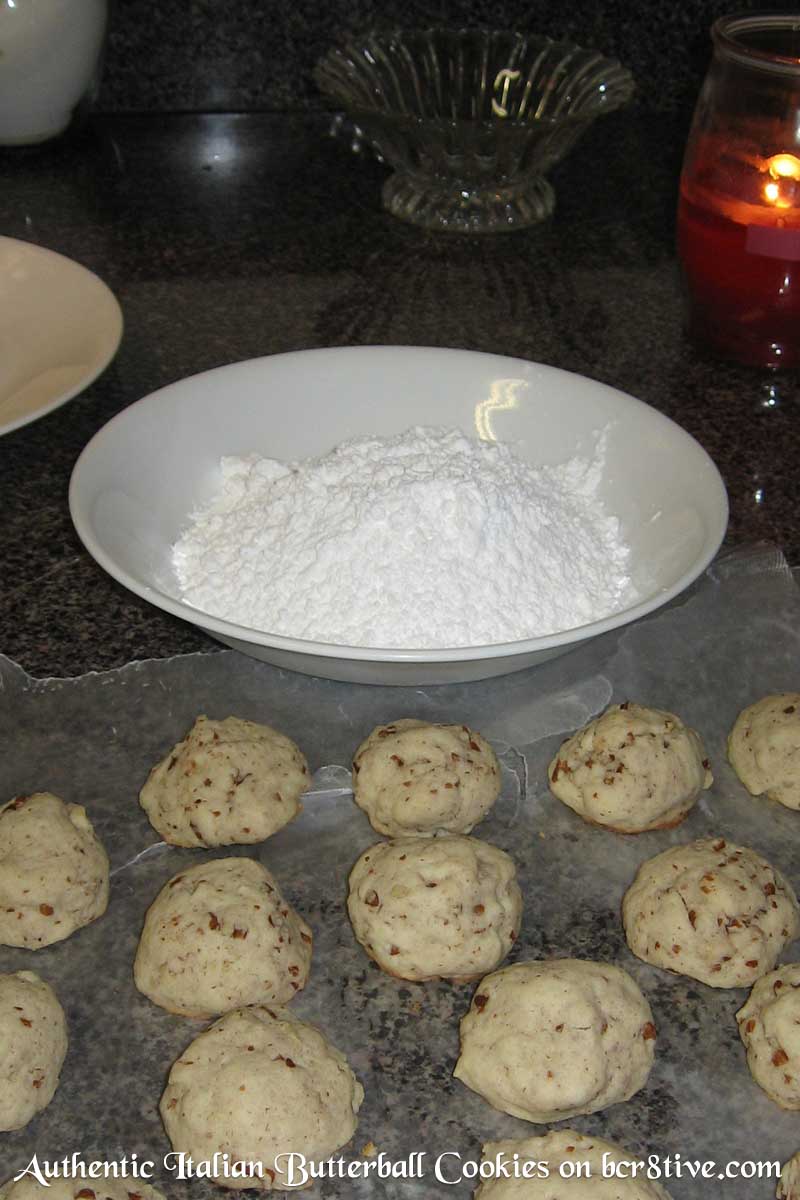 Roll the cooled cookies in the confectioners sugar to coat.